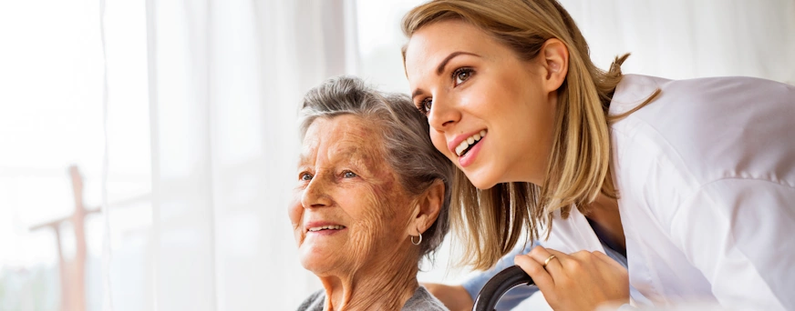 Life Assure Health Visitor And Senior Woman During Home Visit Hero